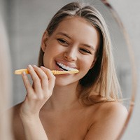 Young woman brushing her teeth