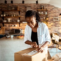 Woman opening a package