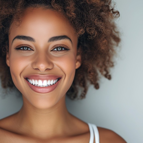 Female patient after receiving cosmetic dental bonding