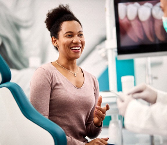 Woman smiling at the dentist’s office