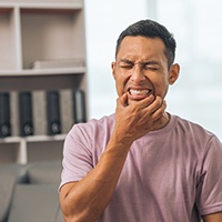 Man dealing with mouth pain