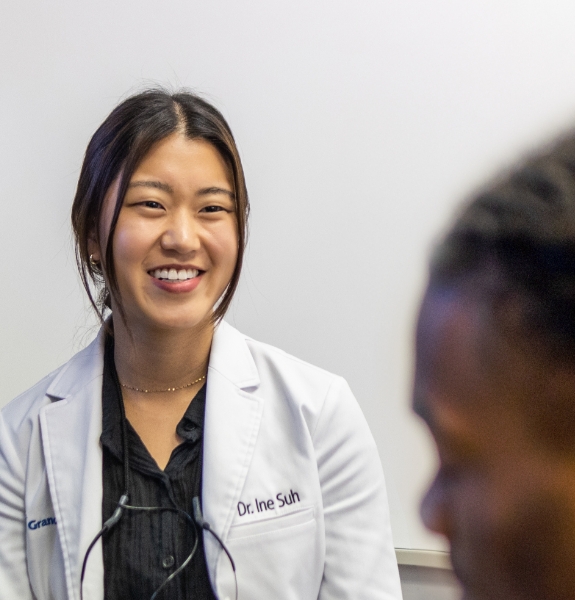 Dr. Suh smiling at patient