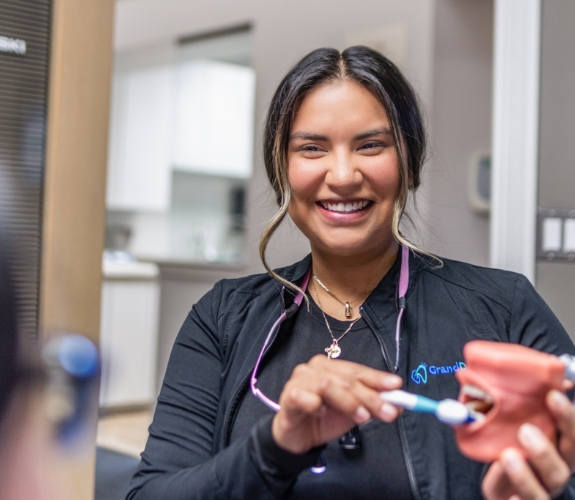 Woman smiling during preventive dentistry checkup