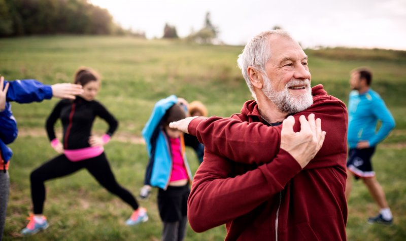 older man exercising outside